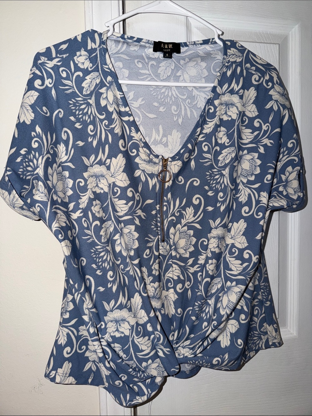 Blue Floral Zip-Front V-Neck Blouse with Twist Hem